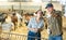 Owner of livestock farm tells the hired worker where to clean barn