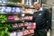 Owner manager posing with produce in isle at local Pick n Pay grocery store