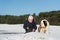 Owner with rescue dog in snow