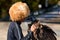 Owner talks to his Black vulture. Bird for tourist photos