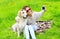 Owner woman with Golden Retriever dog taking selfie portrait