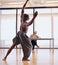 Owning the dance floor. Rearview shot of a male dancer performing before a judge during an audition.