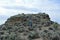 Owyhee Canyonlands Wilderness near Shoofly Oolite man walking up rock horizontal