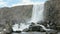 Oxararfoss waterfall in a National park Thingvellir in Iceland in cloudy day