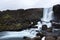 Oxararfoss waterfall streams falling from the mountain, Tingvellir National Park, Iceland