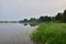 Oxbow lake and the floodplain by the river on a gloomy, cloudy evening. River, Day