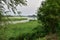 Oxbow lake and the floodplain by the river on a gloomy, cloudy evening. River, Day