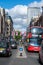 Oxford Street decorated with Union Jack flags for the Jubilee and London Black Taxis and a Red Double Decker Bus in the foreground