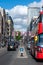 Oxford Street decorated with Union Jack flags for the Jubilee and London Black Taxis and a Red Double Decker Bus in the foreground