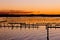 Oyster Farm Beds silhouetted by colors of sunset