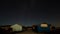 Oyster huts of Saint Trojan les Bains at night under sky with stars time lapse