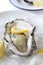 Oyster served on ice with lemon