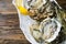 Oysters, lemons and ice on the plate