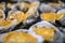 Oysters in a pan in a creamy sauce and cheese. Against a table background