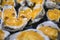 Oysters in a pan in a creamy sauce and cheese. Against a table background