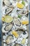 Oysters platter with lemon, lime and ice. Healthy food, gourmet food. Oyster dinner in restaurant