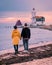 Paard van Marken Lighthouse in the netherlands, couple visiting the fishing village Marken Holland