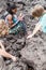 PACAYA, GUATEMALA - MAR 28, 2016: Tourists roasting Marshmallow at the lava field of Pacaya volcano, Guatema