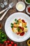 Paccheri con rag alla bolognese - noodles with bolognese sauce on wooden table