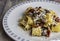 Paccheri pasta with pioppini mushrooms, dried tomato and sheep`s ricotta