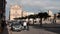 pachino, italy - dec 4, 2015: pachino sicily italy piazza surrounded by buildings shops with people trees 317 v