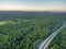 Pacific Highway and native Australian forest at sunset.