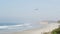 Pacific ocean beach. Del Mar, California USA, Seagrove park. Pelican birds flying in misty fog haze
