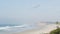 Pacific ocean beach. Del Mar, California USA, Seagrove park. Pelican birds flying in misty fog haze.