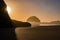 Pacific Ocean sunset view of Face Rock in Bandon Oregon in panoramic format.