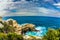 Pacific ocean waves crash down on the shore. Coastal rocks formed a picturesque arch of sandstone. Great Ocean Road of Australia.