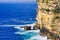 Pacific Ocean Waves Crashing at Bottom of Sandstone Cliffs, Sydney, Australia