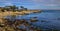 Pacific Ocean waves crashing on the rugged Northern California coastline in Monterey