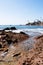 Pacific rocky coastline showing surf area.