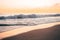 Pacific waves and sandy beach at sunset