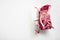 Pack with fresh beef steak cut for sous vide in vacuum plastic market bag, on white stone  background, with copy space for text