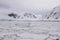 Pack ice with icebergs along Antarctic coastline