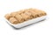 Pack of raw frozen croquettes on a white tray. Product on white background