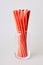 Pack of red disposable paper straws for party cocktails