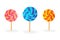 Pack of three lollipops. Candy on a stick with a twisted design