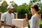 Package Delivering. Delivery Man Delivering Box To Woman