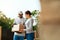 Package Delivering. Delivery Man Delivering Box To Woman