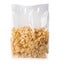 Package with healthy cornflakes on white background