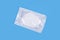 Package of KN95 masks  on light blue background