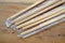 Package of readymade bamboo chopsticks on wooden background