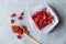 Package of Red Raisins in Plastic Bag with Wooden Spoon.