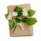 Package wrapped in kraft paper and tied with a rope and flowers