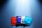 Packaged condoms on blue background, top view with space for text. Safe sex