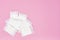 packaged cotton sanitary pad napkin on pink background, copy spase