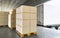 Packaging Boxes Stacked on Pallets Load with Shipping Cargo Container. Delivery Trucks Loading at Dock Warehouse. Supply Chain.