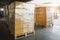 Packaging Boxes Stacked Wrapped Plastic on Pallets Loading with Shipping Cargo Container. Delivery Trucks Loading Dock Warehouse.